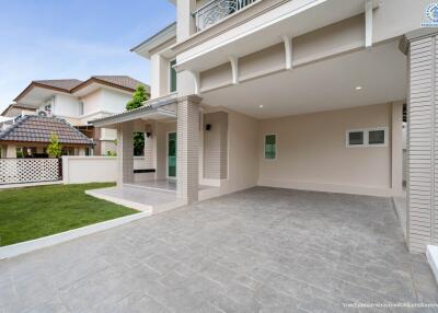 Modern residential house exterior with driveway and lawn