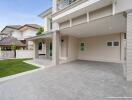 Modern residential house exterior with driveway and lawn