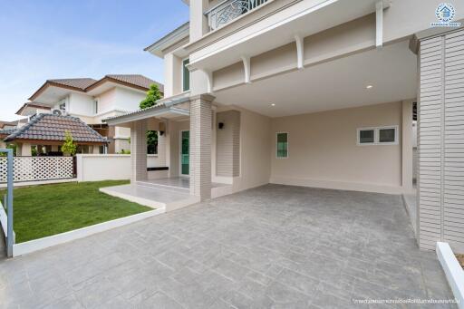 Modern residential house exterior with driveway and lawn