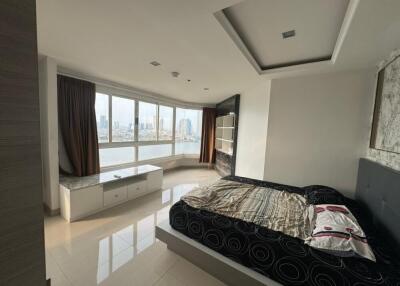 Spacious bedroom with large windows