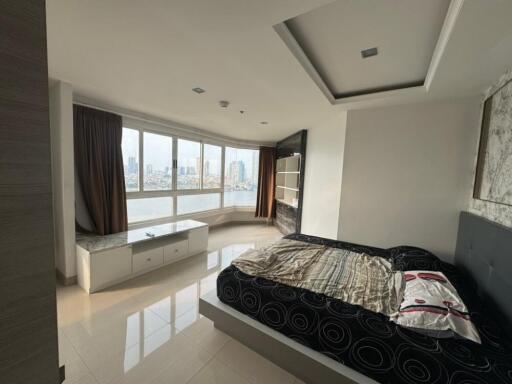 Spacious bedroom with large windows