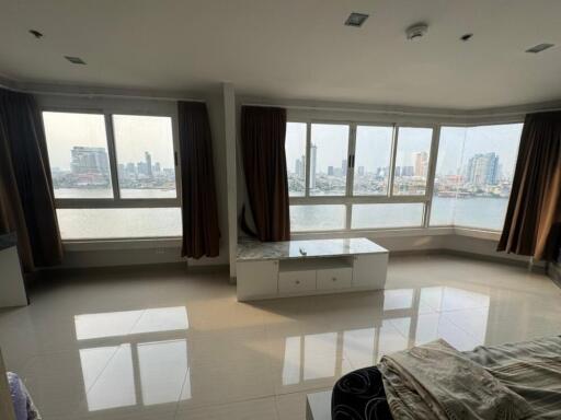 Living room with large windows and city view