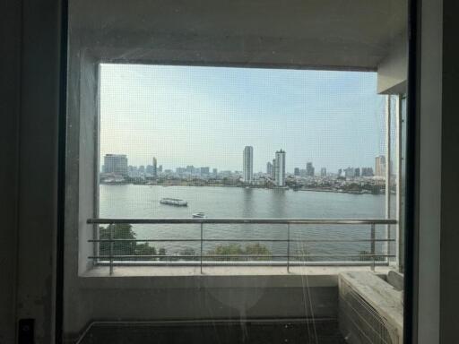 Balcony view overlooking the river and city skyline