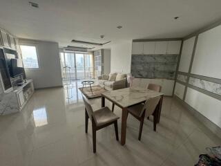 Modern living room with dining area and large windows