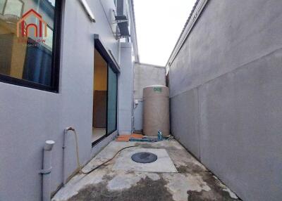 Outdoor alley with water storage tank and building side