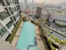 High-rise building with swimming pool overlooking the city