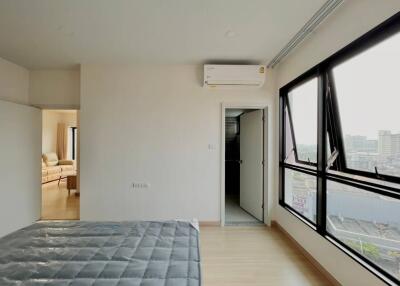 Modern bedroom with large windows and view