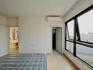 Modern bedroom with large windows and view