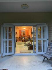 Living room view through open sliding doors