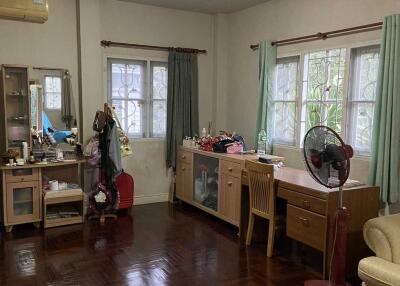 Bedroom with hardwood floors and furniture