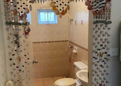 Bathroom with bead curtain entrance