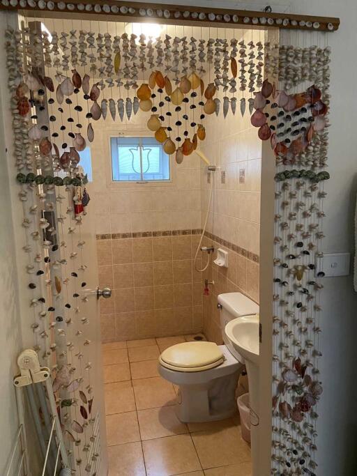 Bathroom with bead curtain entrance