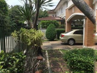 Exterior view of the house with garden and driveway