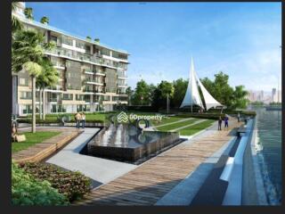 Modern apartment complex with garden area and waterfront view