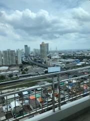 View from a balcony over a cityscape