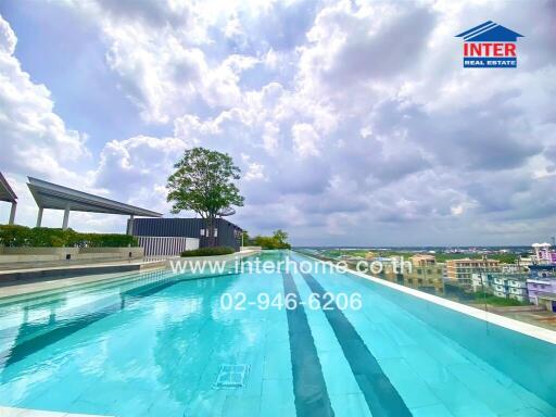 Swimming pool on a rooftop with a view of the cityscape