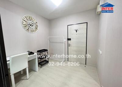 Entryway with desk and decorative clock