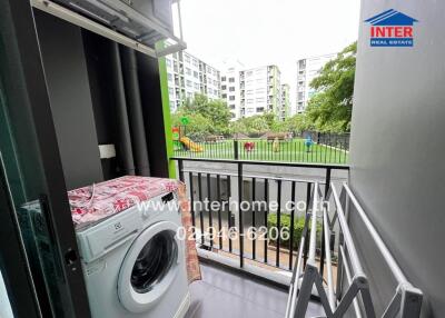 Balcony with a view of a garden and playground