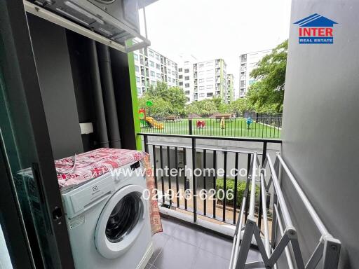 Balcony with a view of a garden and playground