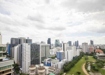 Panoramic view of a city skyline with buildings and a park