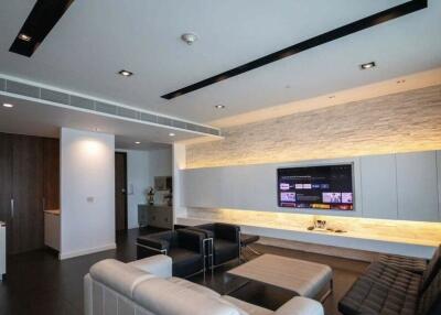 Modern living room with TV and cozy seating area