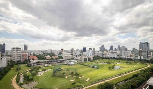 Panoramic cityscape view with a golf course