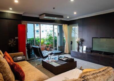 Comfortable living room with modern decor and balcony view