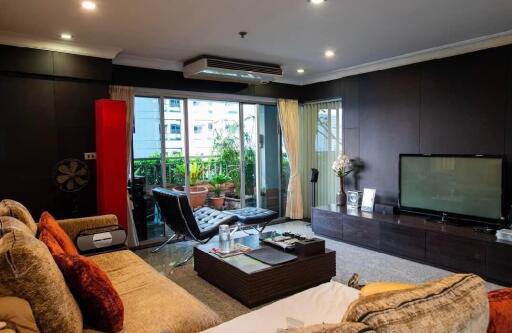 Comfortable living room with modern decor and balcony view