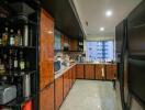 Modern kitchen with wooden cabinets, appliances, and a large refrigerator