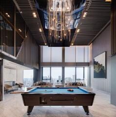 Modern living area with pool table and chandelier