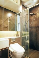 Modern bathroom with glass shower and toilet