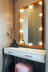 Bedroom vanity with mirror and lights