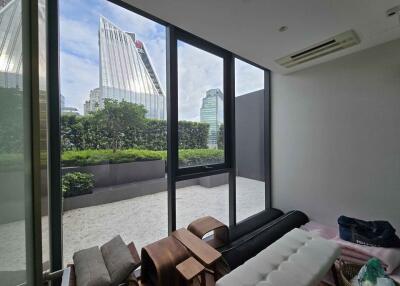 Modern living room with large windows and city view