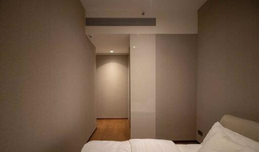 Bedroom with bed and corridor view