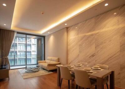 Modern living room with dining area and floor-to-ceiling window