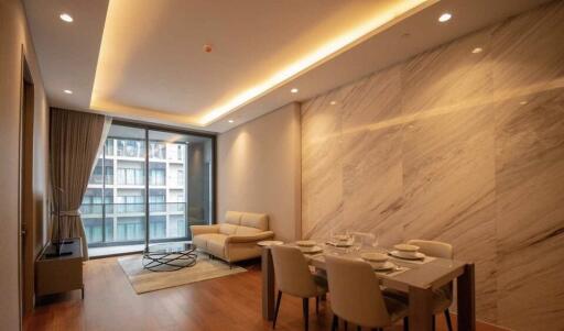 Modern living room with dining area and floor-to-ceiling window