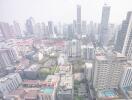 Aerial view of a city skyline with various high-rise buildings and residential areas