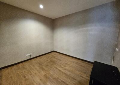 Empty bedroom with wooden floor