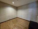 Empty bedroom with wooden floor