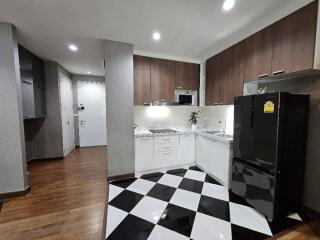 Modern kitchen with checkered flooring