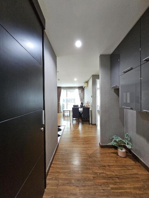 Modern hallway leading to a dining area