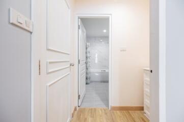 Entrance to a bathroom with white door