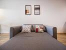 Living room with a gray sofa and decorative pillows