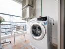 Balcony with washing machine and city view