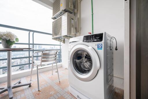 Balcony with washing machine and city view