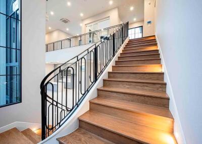 Staircase leading to upper floor with modern railing