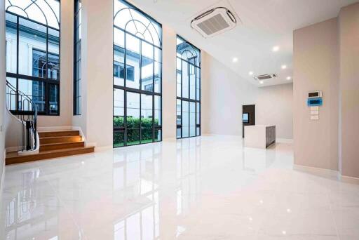 Spacious main living area with large windows and modern interior