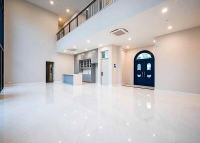 Spacious living area with modern kitchen and balcony