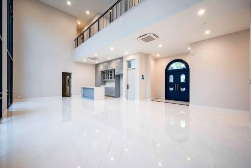 Spacious living area with modern kitchen and balcony