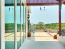 Spacious balcony with glass doors and wooden roof